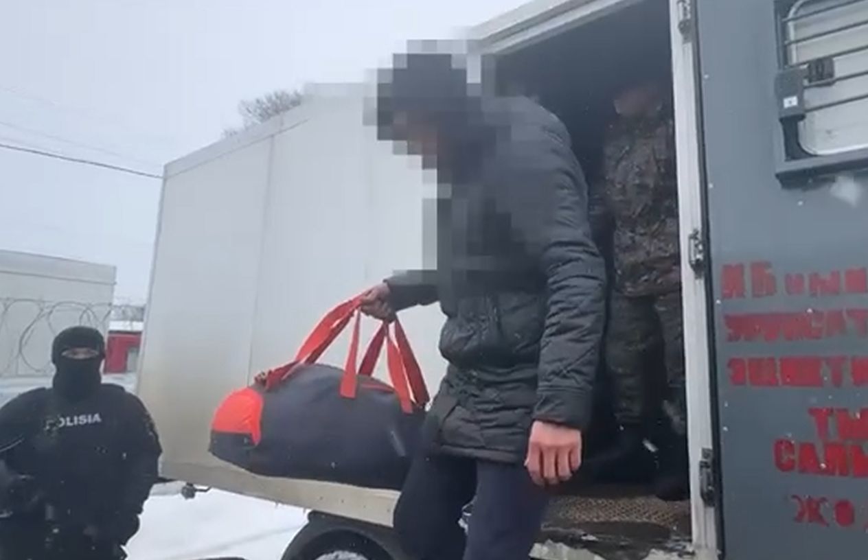 women sit back relax after exercise there is water bottle dumbbells