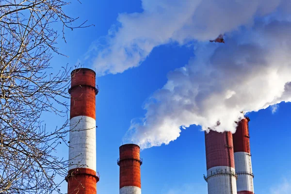 depositphotos 139376926 stock photo chimneys with steam production of