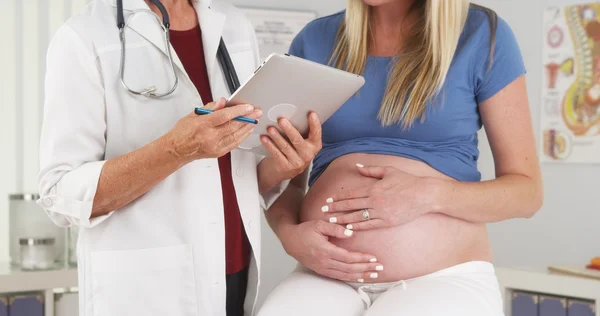 depositphotos 57342331 stock photo pregnant woman and doctor in