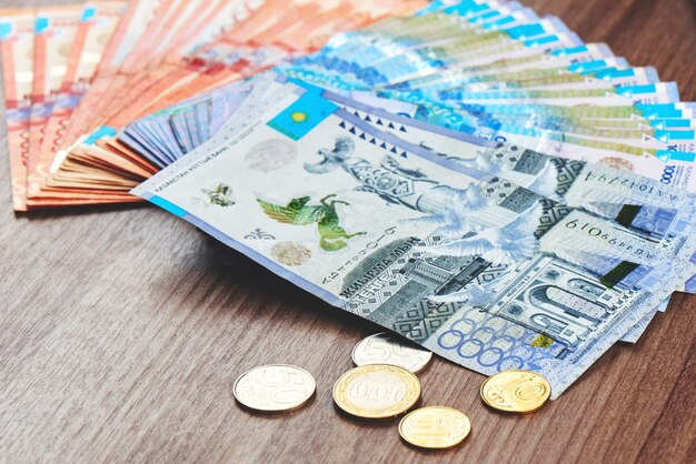 tenge kazakh money is spread out brown wooden table close up 154092 12071