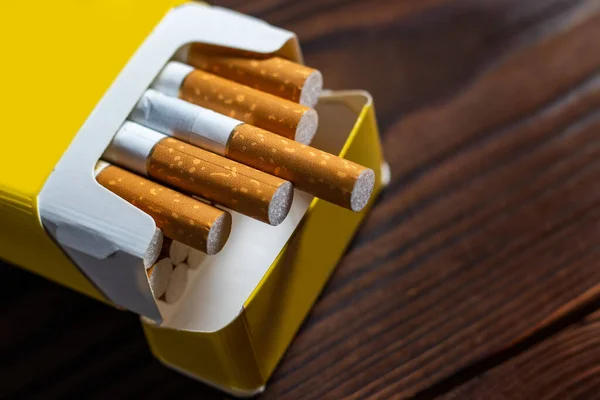 depositphotos 630853722 stock photo cigarettes pack yellow filter harm