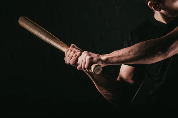stock photo cropped shot young man playing baseball bat isolated black