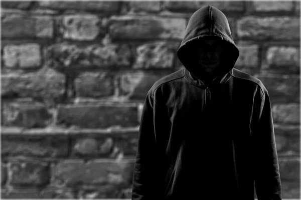 depositphotos 118571410 stock photo dark unrecognisable man in hoodie
