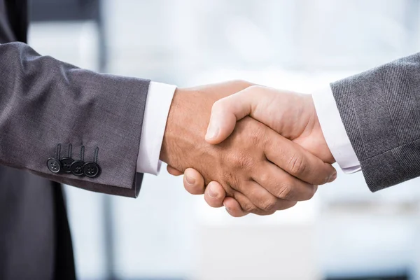 depositphotos 151248194 stock photo businessmen shaking hands