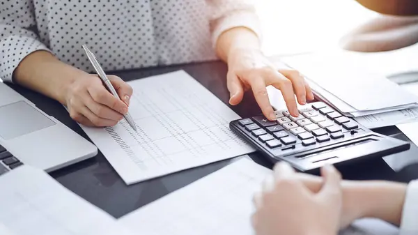 depositphotos 759111934 stock photo woman accountant using calculator laptop